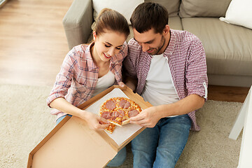 Image showing couple eating takeaway pizza at home