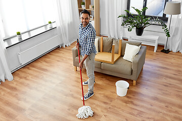 Image showing indian man with mop and bucket cleaning at home