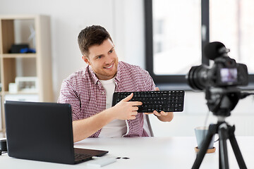 Image showing male video blogger with keyboard videoblogging