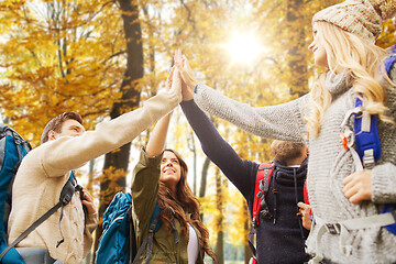 Image showing friends making high five on hike in autumn