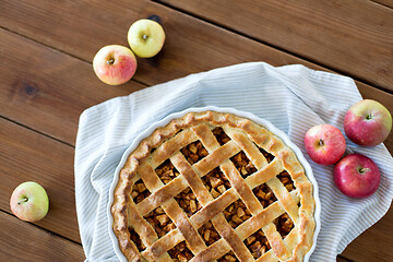 Image showing apple pie in baking mold on wooden table