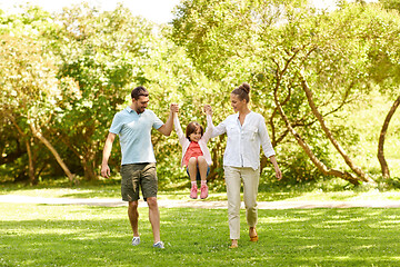 Image showing happy family walking in summer park