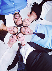 Image showing business people with their heads together