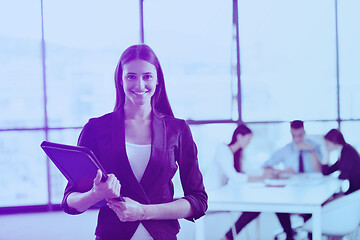 Image showing business woman with her staff in background at office