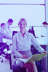 Image showing business woman with her staff in background at office