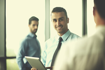 Image showing business man using tablet compuer at office