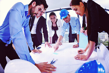 Image showing business people and engineers on meeting