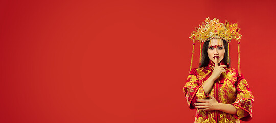 Image showing Chinese traditional woman. Beautiful young girl wearing in national costume