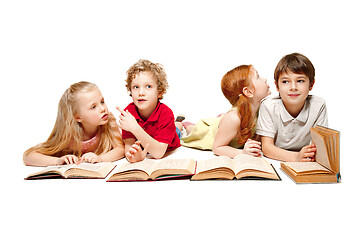 Image showing The kids boy and girls laying with books isolated on white