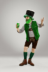 Image showing A man in a leprechaun hat at studio. He celebrates St. Patrick\'s Day.