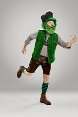 Image showing A man in a leprechaun hat at studio. He celebrates St. Patrick\'s Day.