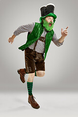 Image showing A man in a leprechaun hat at studio. He celebrates St. Patrick\'s Day.