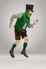 Image showing A man in a leprechaun hat at studio. He celebrates St. Patrick\'s Day.