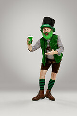 Image showing A man in a leprechaun hat at studio. He celebrates St. Patrick\'s Day.