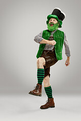 Image showing A man in a leprechaun hat at studio. He celebrates St. Patrick\'s Day.