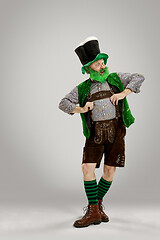 Image showing A man in a leprechaun hat at studio. He celebrates St. Patrick\'s Day.