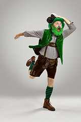 Image showing A man in a leprechaun hat at studio. He celebrates St. Patrick\'s Day.