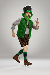 Image showing A man in a leprechaun hat at studio. He celebrates St. Patrick\'s Day.