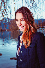 Image showing Portrait of a young brunette woman at the lake