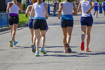 Image showing Group Young girls friends running on the city street