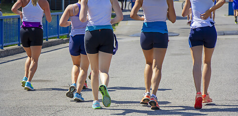 Image showing Group Young girls friends running on the city street