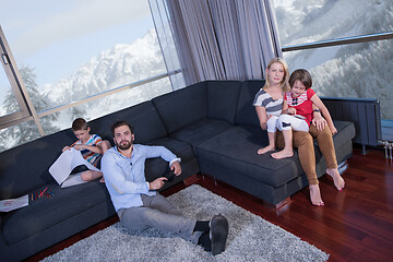 Image showing Happy Young Family Playing Together on sofa