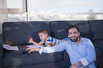Image showing Happy Young Family Playing Together on sofa