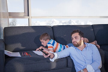Image showing Happy Young Family Playing Together on sofa