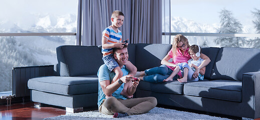 Image showing Happy family playing a video game