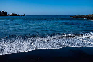 Image showing beautiful view on ocean water and black lava sand