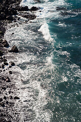 Image showing beautiful view on ocean water and black lava sand