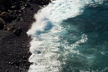 Image showing beautiful view on ocean water and black lava sand