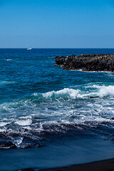 Image showing beautiful view on ocean water and black lava sand