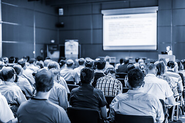 Image showing Woman giving presentation in lecture hall at university.