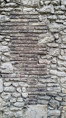 Image showing Rough very old wall with bricks and cobblestones