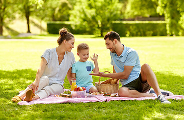 Image showing happy family having picnic at summer park