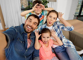 Image showing family taking selfie and making faces at home