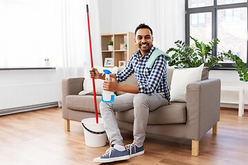 Image showing indian man with mop and detergent cleaning at home