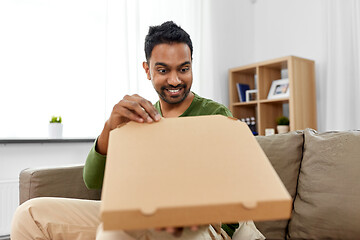 Image showing indian man looking inside of takeaway pizza box