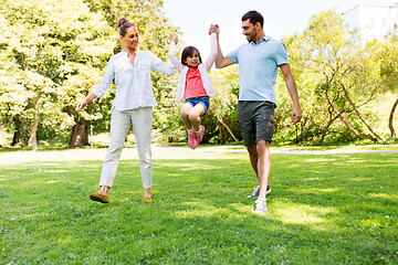 Image showing happy family walking in summer park