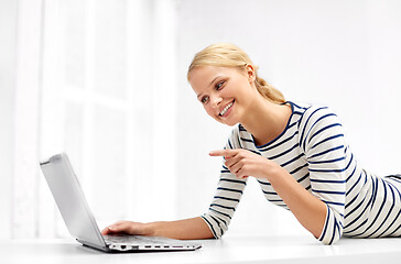Image showing woman having video call on laptop computer at home