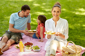 Image showing happy family having picnic at summer park