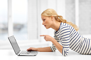 Image showing woman having video call on laptop computer at home