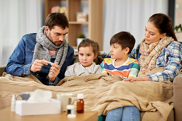 Image showing family with ill children having fever at home