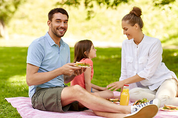 Image showing happy family having picnic at summer park