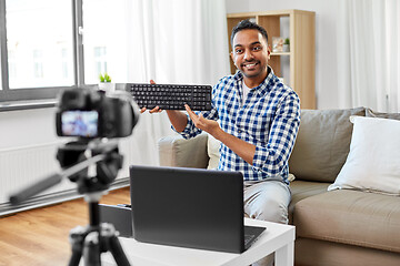 Image showing male video blogger with keyboard videoblogging