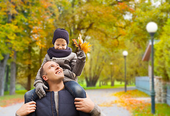 Image showing happy family having fun in autumn park