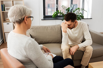 Image showing senior woman psychologist and sad man patient