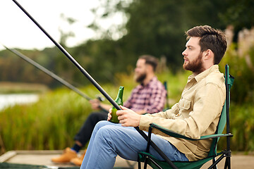 Image showing friends fishing and drinking beer at lake
