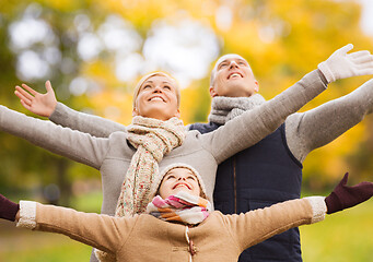 Image showing happy family having fun in autumn park